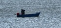 Fisherman collecting his catch in Punic Ports of Carthage.